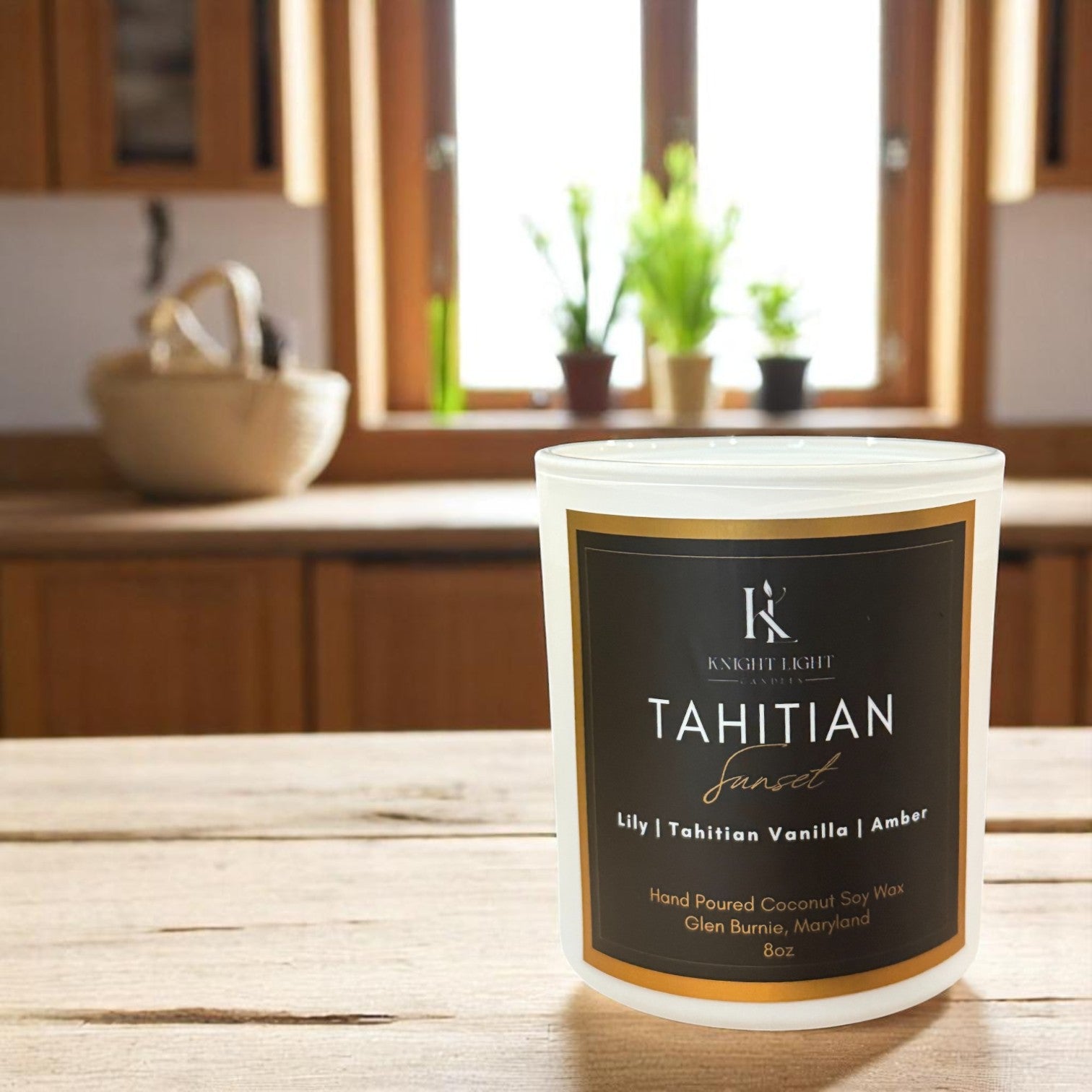 Knight Light Candles 'Tahitian Sunset' coconut soy wax candle with wood wick, featuring notes of lily, Tahitian vanilla, and amber – styled on books in a cozy, golden-lit setting.
